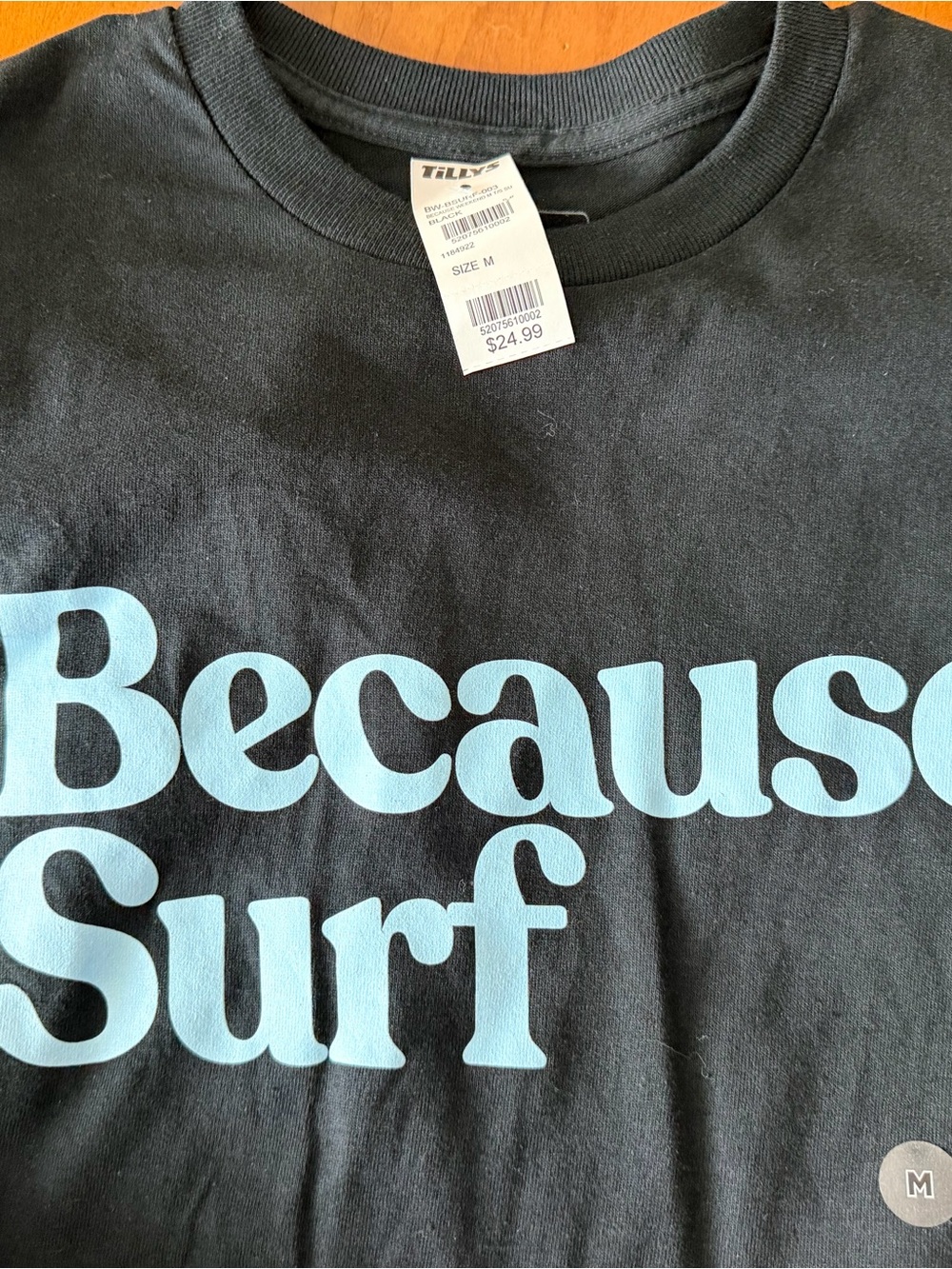 Tilly's Black Tee with Light Blue "Because Surf" Graphic